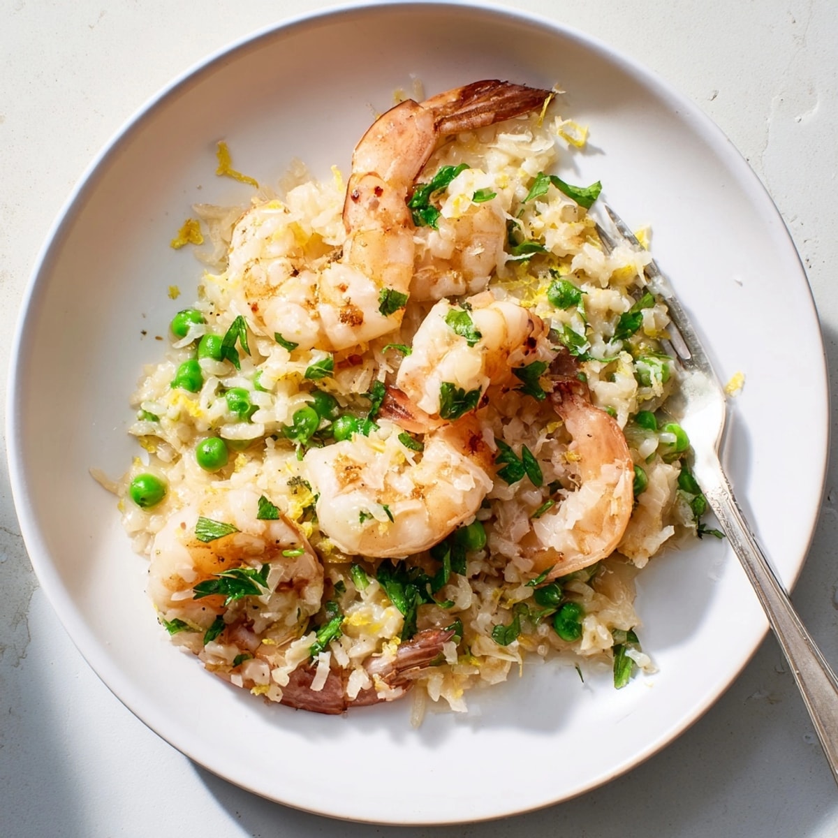 Creamy Shrimp Parmesan Rice Skillet: Fresh parsley and lemon zest elevate this simple dinner.
