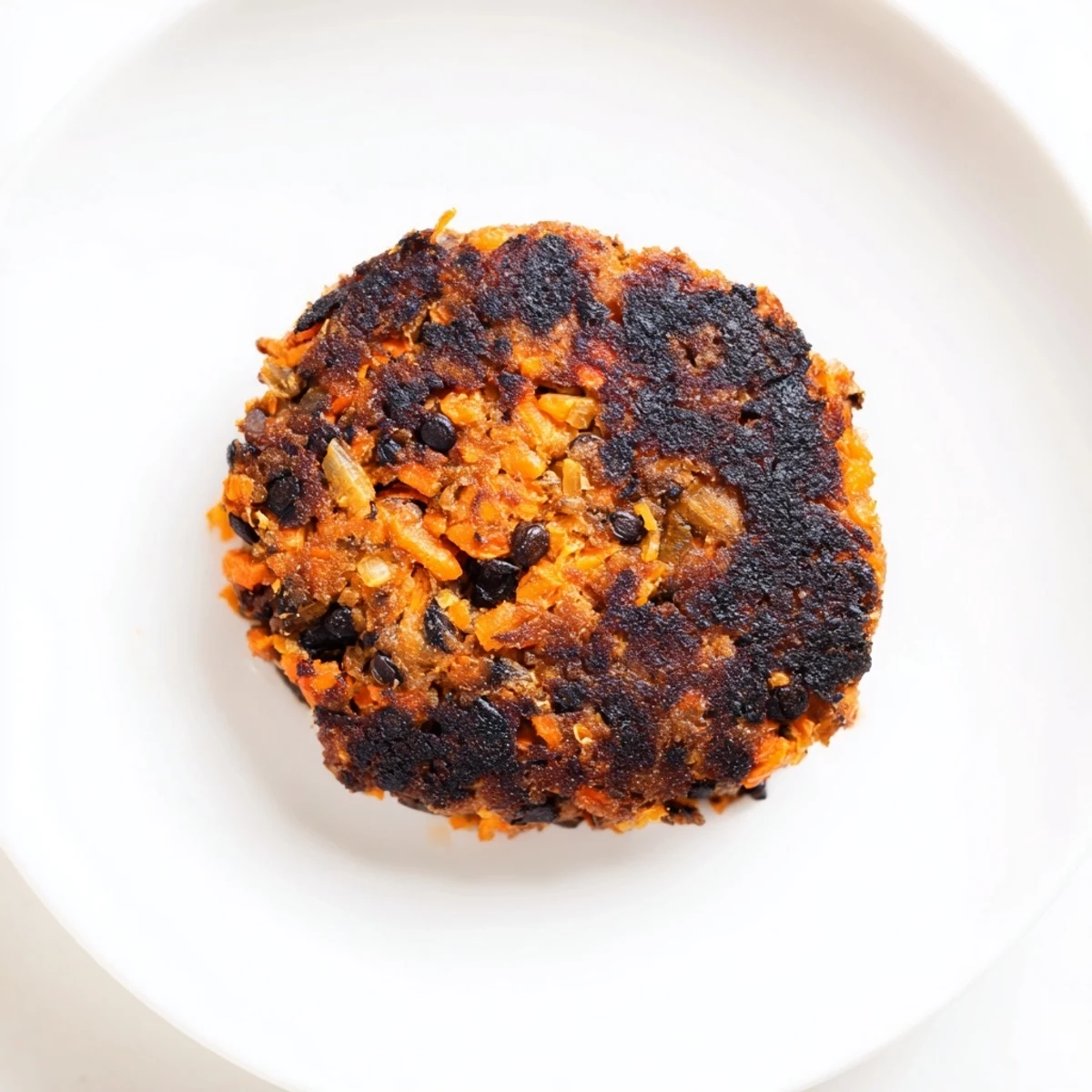 Stack of savory black bean burgers, served with vibrant toppings, offer a delicious vegan grilling option.