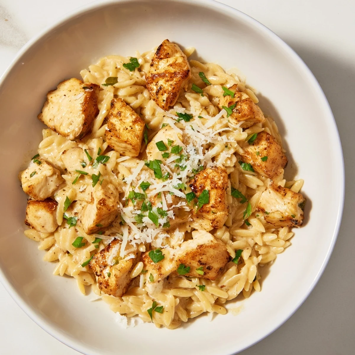 One-Pot Cajun Chicken Alfredo Orzo, a creamy skillet full of tender chicken and flavorful pasta.