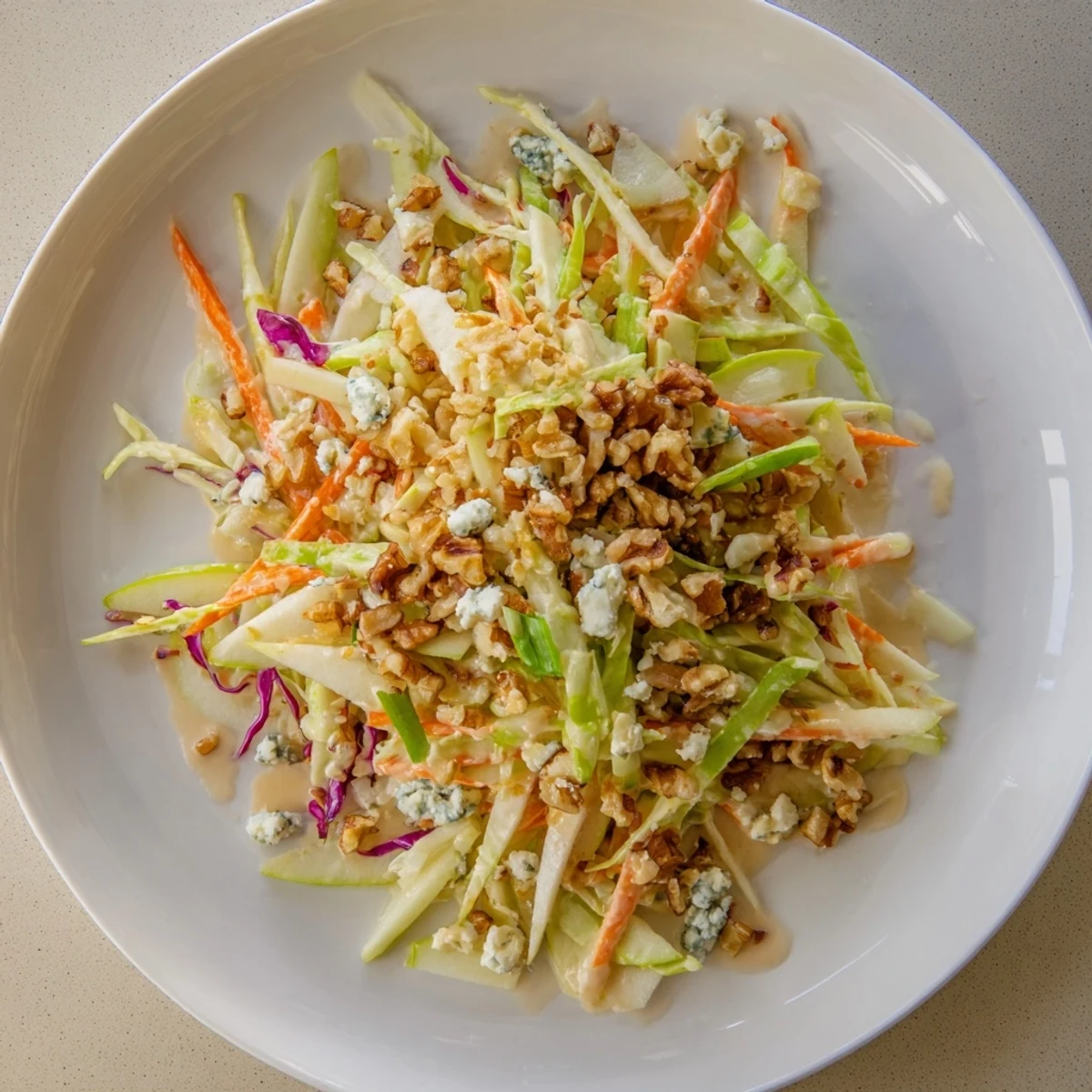 Fresh Crunchy Apple & Walnut Slaw, loaded with vibrant red cabbage, offers a satisfying crunch and flavor.