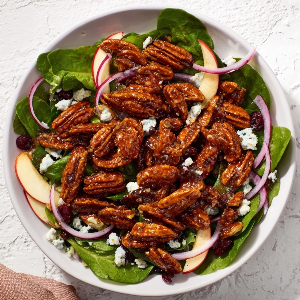 Crisp Gingerbread Spiced Candied Pecan Salad, ready to toss with a zesty maple-balsamic dressing.