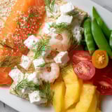 Wave Rider Surfer Snack Board featuring colorful fruits and creamy dips, ready to serve.