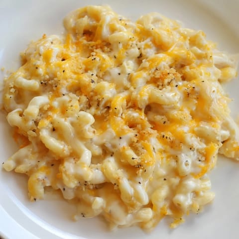 A warm dish of baked Mac & Cheese with Evaporated Milk, with a crisp, golden-brown topping.