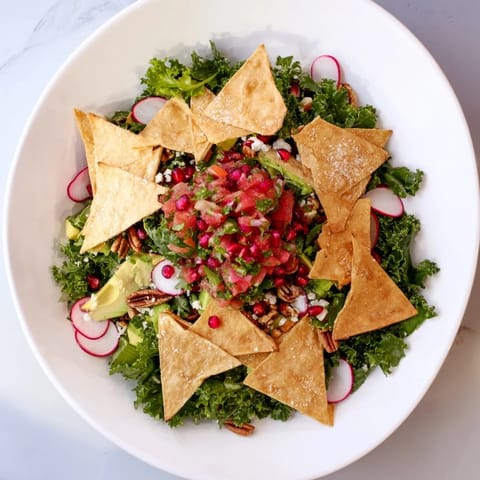 A beautifully arranged Winter Salad boasts colorful vegetables with homemade salsa and feta cheese.