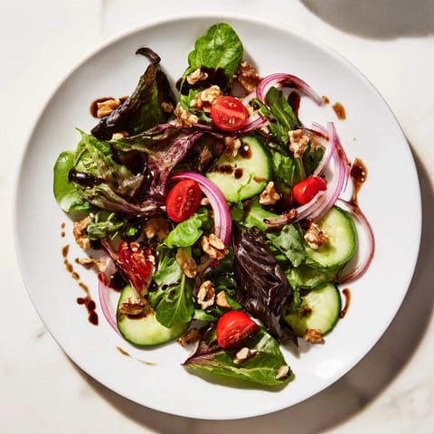 Bright red tomatoes and crunchy cucumber in a Quick Balsamic Vinegar Salad, ready to serve!