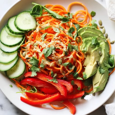 Freshly prepared Carrot Noodle Skincare Bowl showing spiralized carrots as noodles, ready to eat.