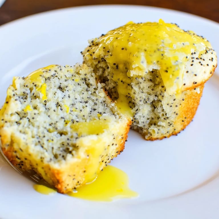 Close-up of fluffy Lemon Poppy Seed Muffins, showing their tender crumb and lovely texture perfect for breakfast.